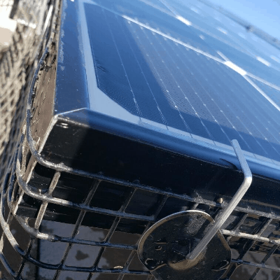 installed cage used to deter rodents and birds from making homes underneath solar panels